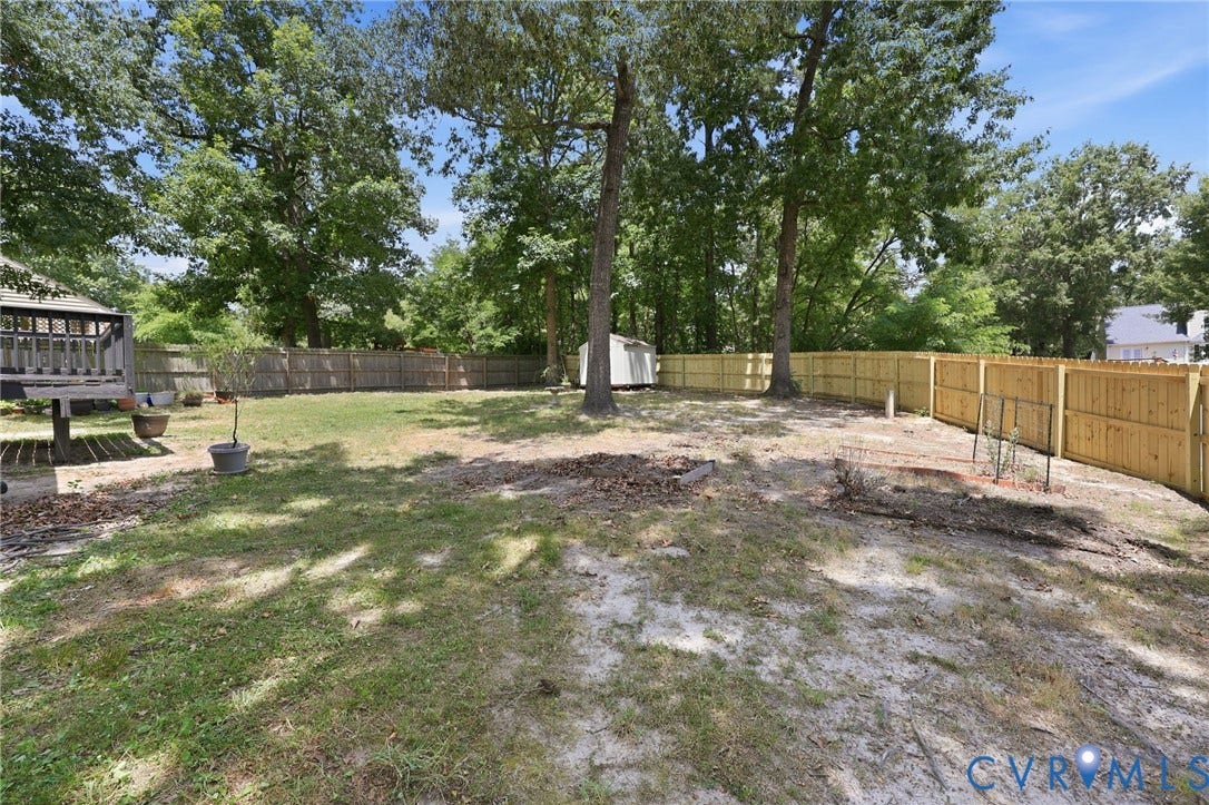 9500 Mesquite Road, Glen Allen, VA 23060 Expansive backyard featuring a combination of wood privacy fencing and mature trees