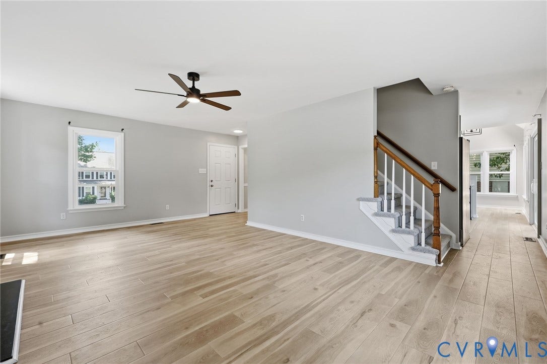 9500 Mesquite Road, Glen Allen, VA 23060 Bright interior space featuring wood-finish flooring, a contemporary ceiling fan, and a light gray color palette