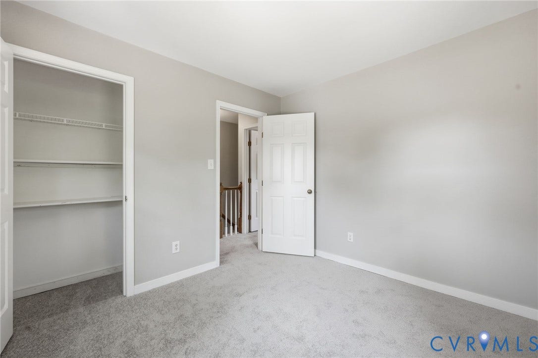 9500 Mesquite Road, Glen Allen, VA 23060 Neutral-toned interior room featuring light gray wall paint, white trim, and gray carpeting