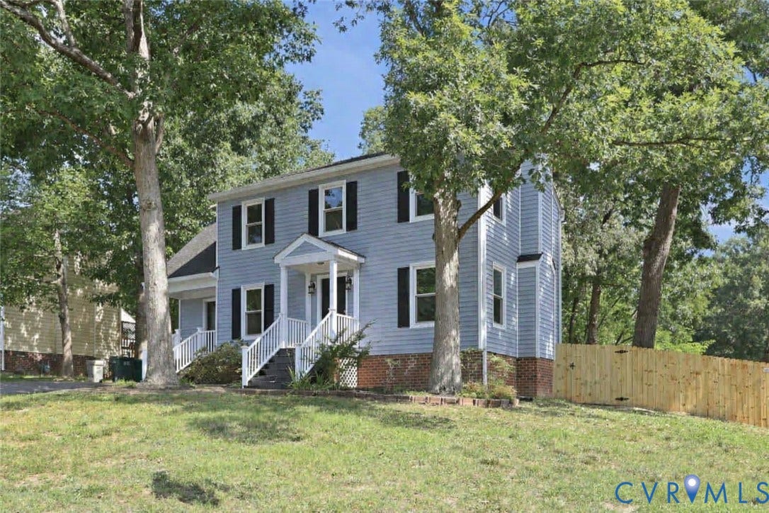 9500 Mesquite Road, Glen Allen, VA 23060 Two-story residence featuring light blue siding, black shutters, white trim, and a brick foundation