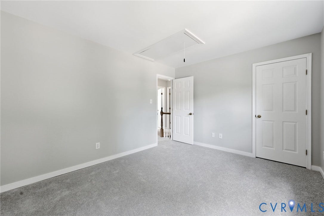 9500 Mesquite Road, Glen Allen, VA 23060 Neutral-toned room featuring light gray carpeting and white baseboards