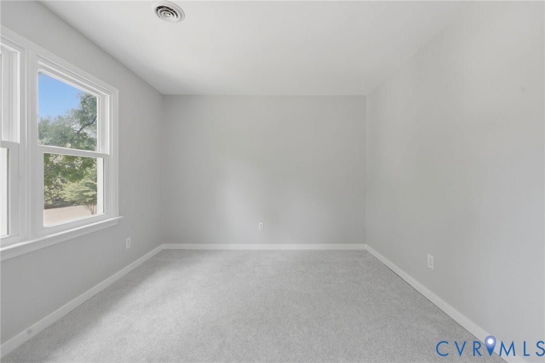 9500 Mesquite Road, Glen Allen, VA 23060 Light gray carpeted room with white baseboards and a double-pane window