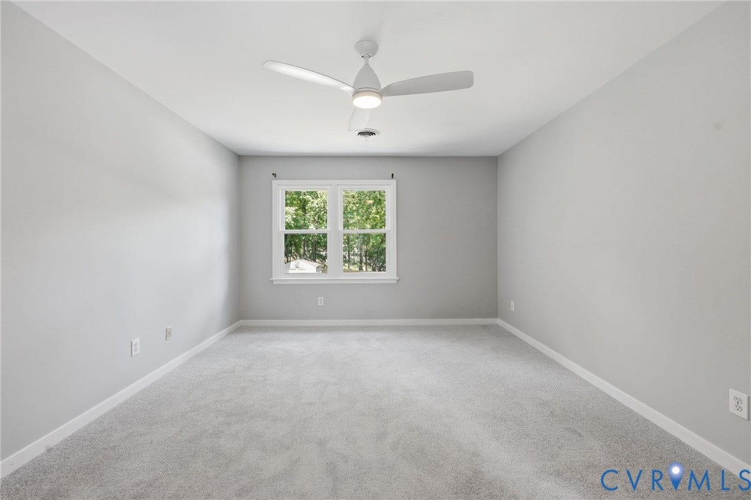 9500 Mesquite Road, Glen Allen, VA 23060 Bright room featuring neutral gray walls, light gray carpeting, and white trim