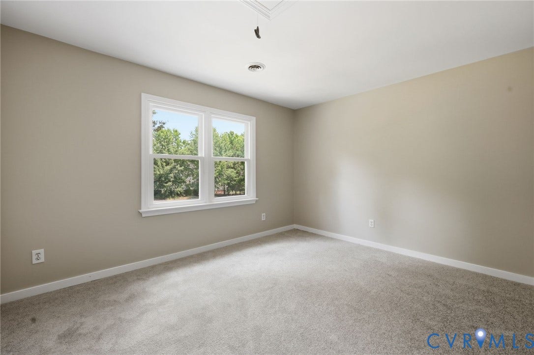 9500 Mesquite Road, Glen Allen, VA 23060 Neutral-toned walls complement the gray carpeting