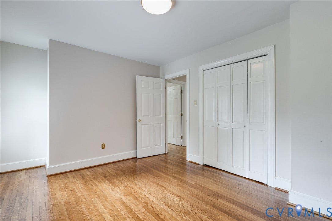 3924 Belspring Road, Chester, VA 23831 Spacious interior room featuring wood-finish flooring, light-toned walls, and white baseboards