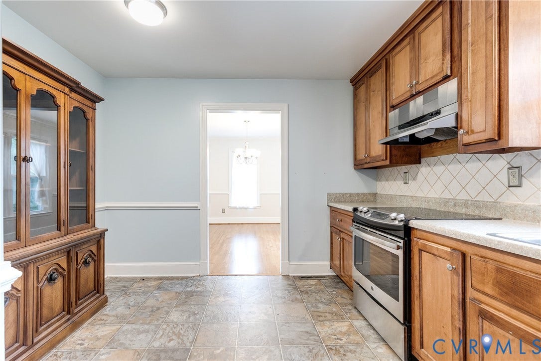 3924 Belspring Road, Chester, VA 23831 Kitchen featuring wood cabinetry, stainless steel range, and stone-look countertops
