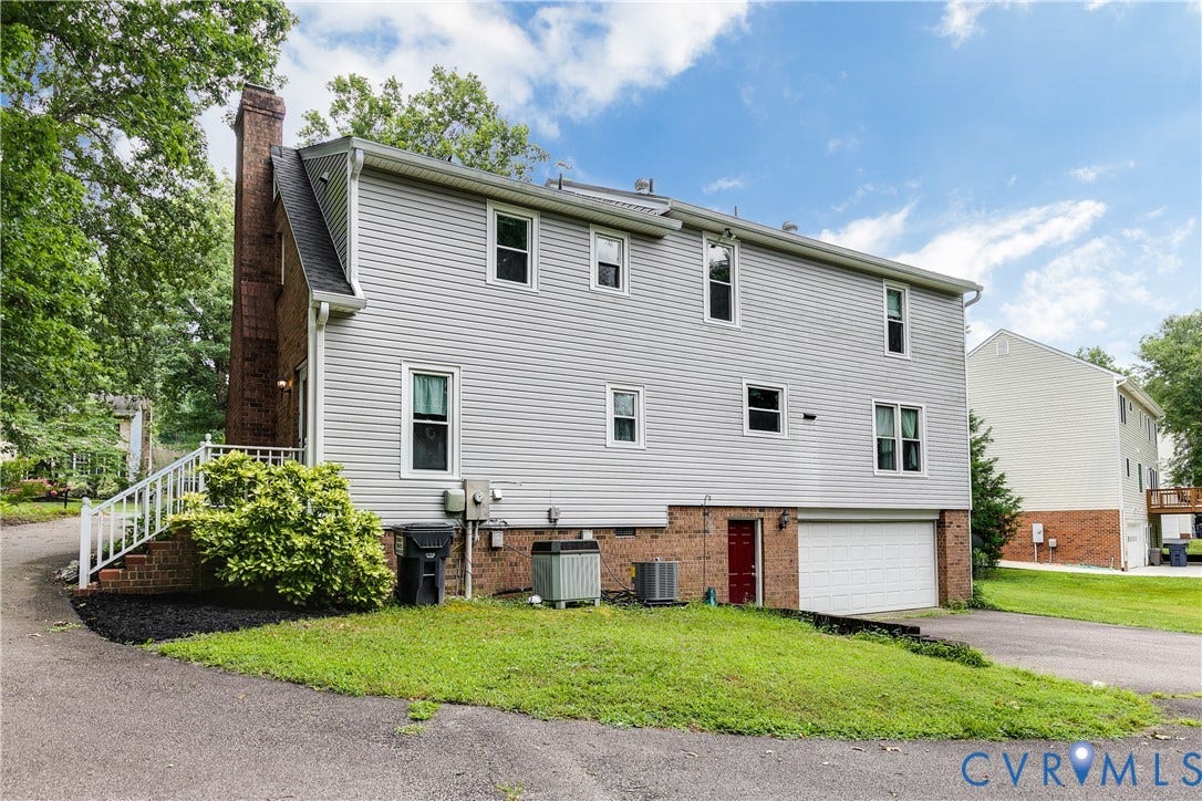 3924 Belspring Road, Chester, VA 23831 Vinyl-sided exterior featuring a brick chimney and a two-story design