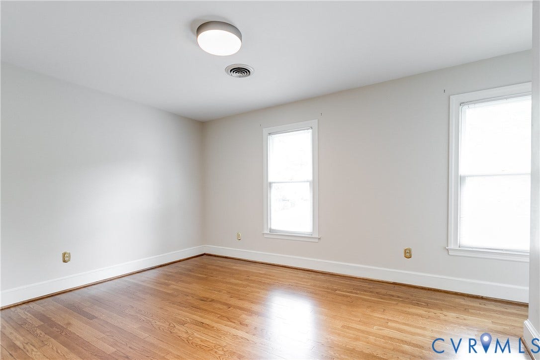 3924 Belspring Road, Chester, VA 23831 Bright interior room featuring wood-finish flooring, white baseboards, and neutral wall paint