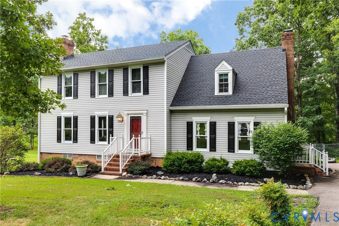 3924 Belspring Road, Chester, VA 23831 Two-story residence featuring light gray siding, a dark shingle roof, and multiple black window shutters