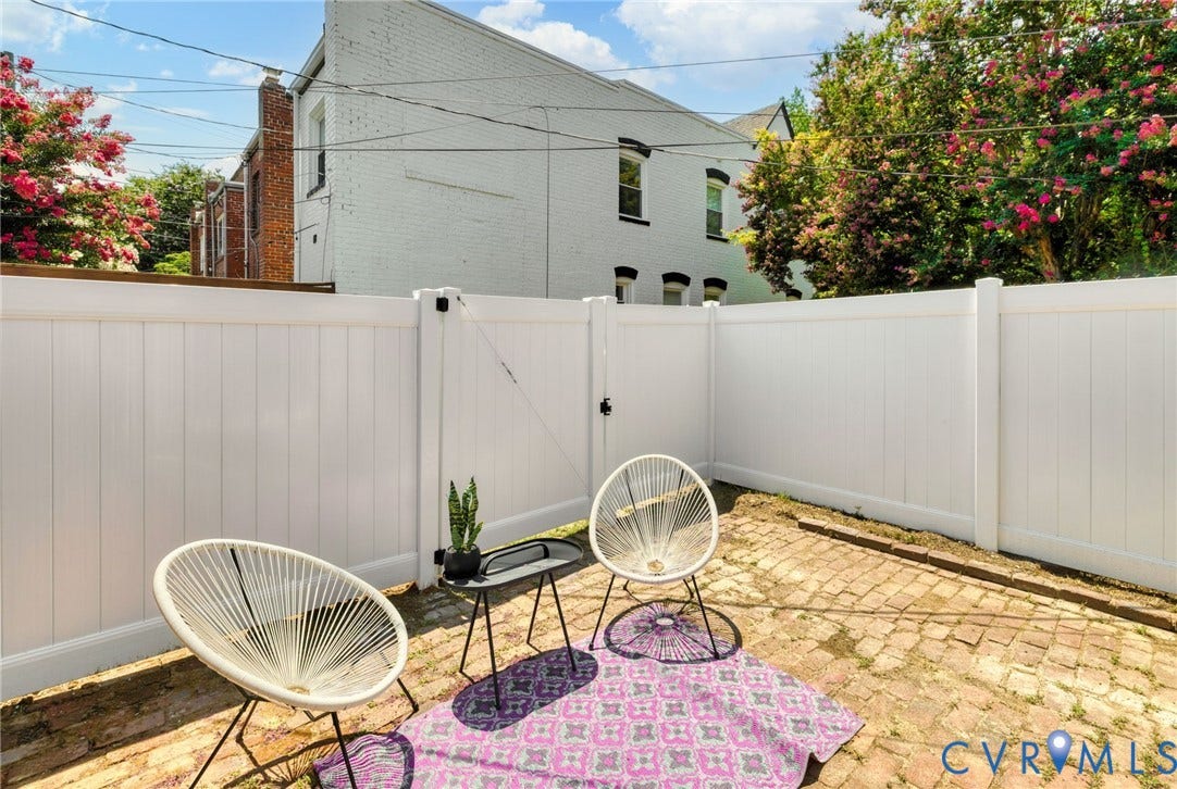 2627 Kensington Avenue, Museum District, Richmond, VA 23220 Enclosed patio space featuring a white privacy fence and brick paver flooring