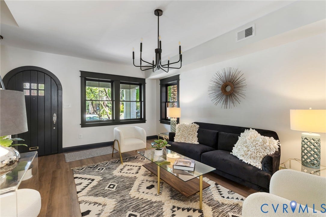 2627 Kensington Avenue, Museum District, Richmond, VA 23220 Living space featuring wood-finish flooring, a contemporary chandelier, and an arched entry door with glass paneling
