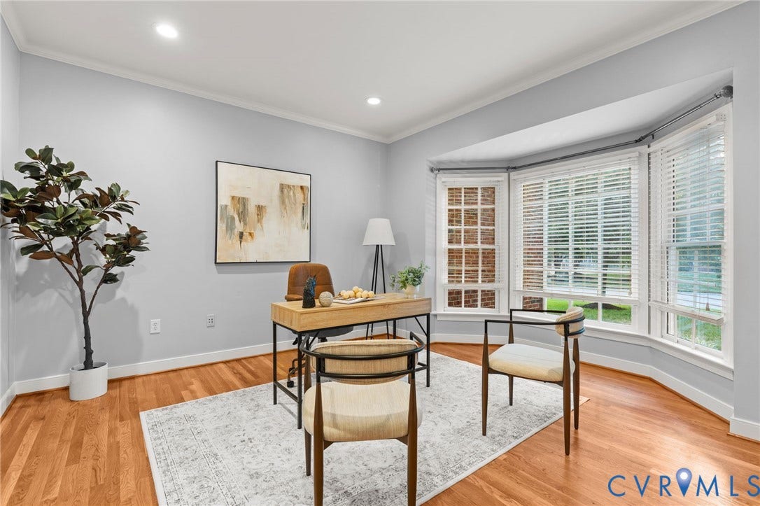Bay window with multiple panels and white wood blinds, hardwood flooring, recessed lighting, crown molding, and light gray wall color