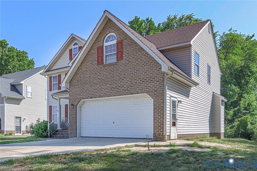 1900 Brilland Court, Glen Allen, VA 23060 Brick and siding exterior featuring a two-car garage with an arched dormer and red window shutters