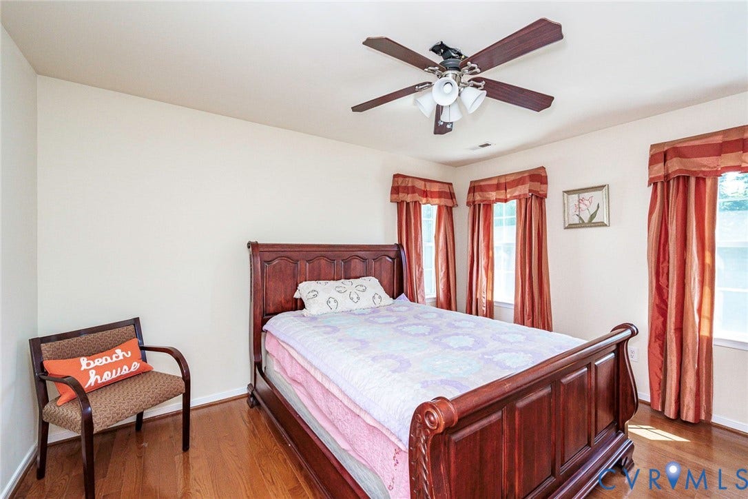1900 Brilland Court, Glen Allen, VA 23060 Bedroom 3 featuring wood-finish flooring, three windows with valances, light-toned walls, and a ceiling fan with integrated lighting