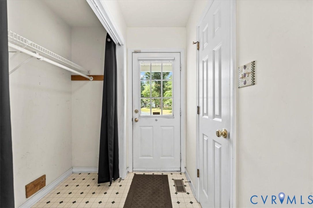 2924 Warfield Ridge Terrace, Chester, VA 23831 Entryway featuring a glass-paneled door, patterned floor tiles, a built-in wire shelf, and a hanging rod