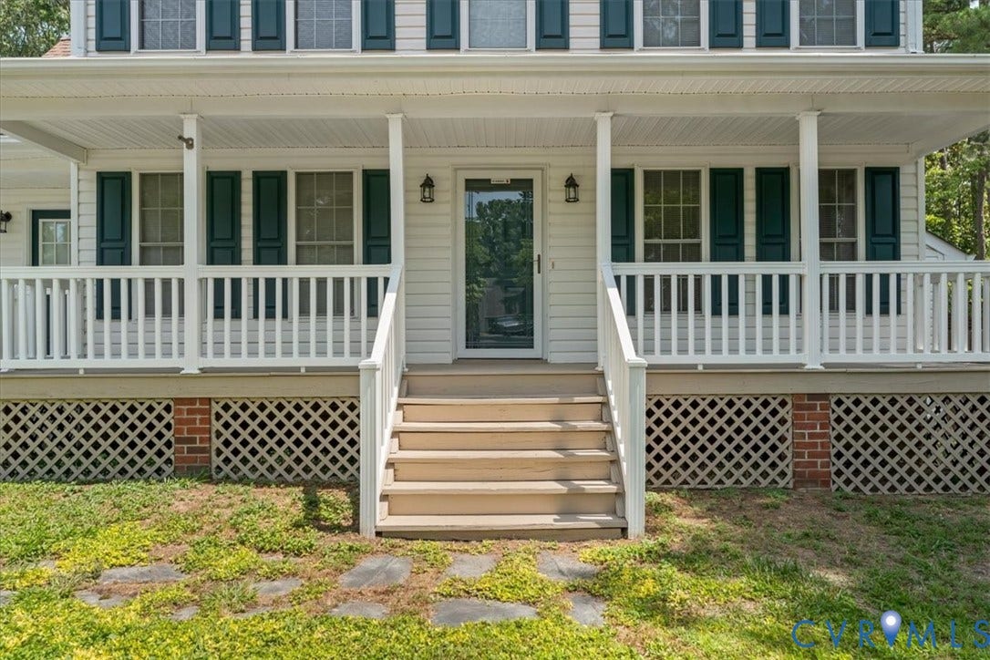2924 Warfield Ridge Terrace, Chester, VA 23831 Front elevation featuring a full-width porch with white railings and columns