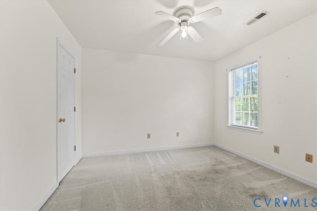 2924 Warfield Ridge Terrace, Chester, VA 23831 Room featuring neutral wall finishes, light-colored carpet, a ceiling fan with integrated lighting, a single window, and a paneled door