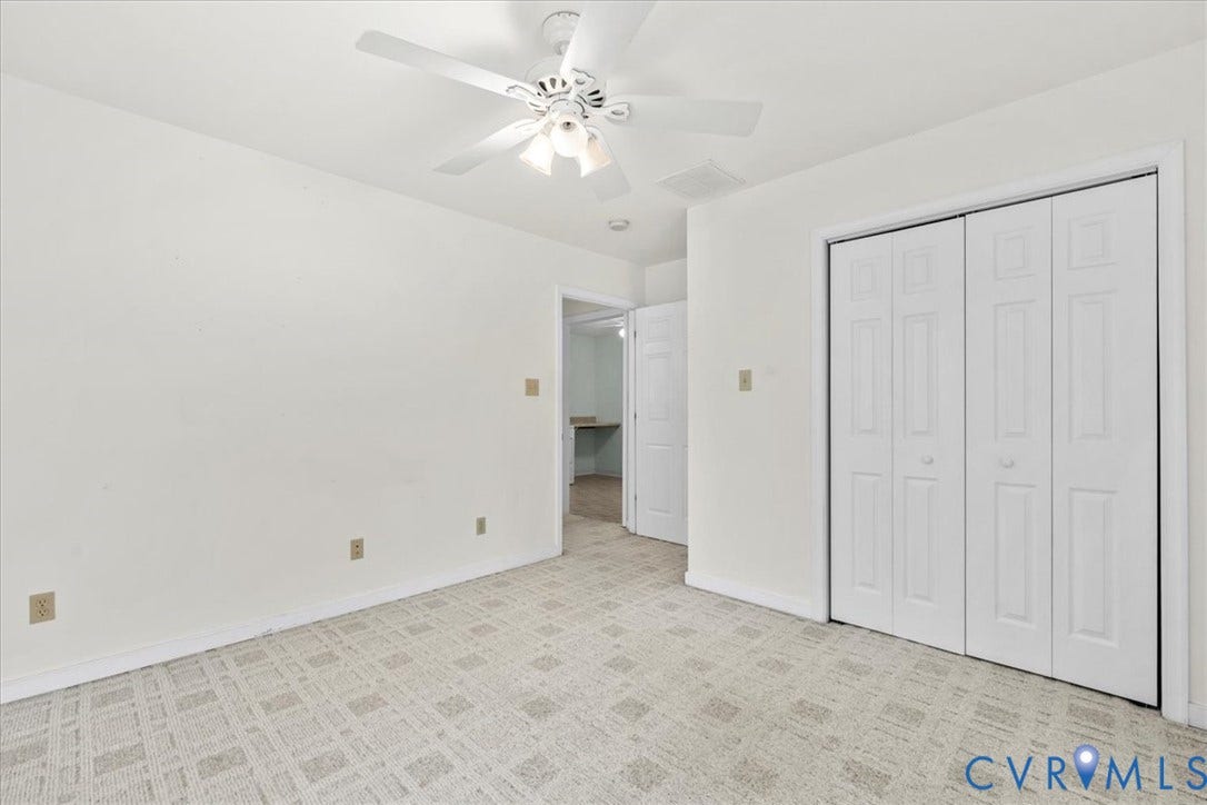 2924 Warfield Ridge Terrace, Chester, VA 23831 Light-colored patterned carpeting throughout, white walls, bifold closet doors, and an overhead ceiling fan with integrated lighting