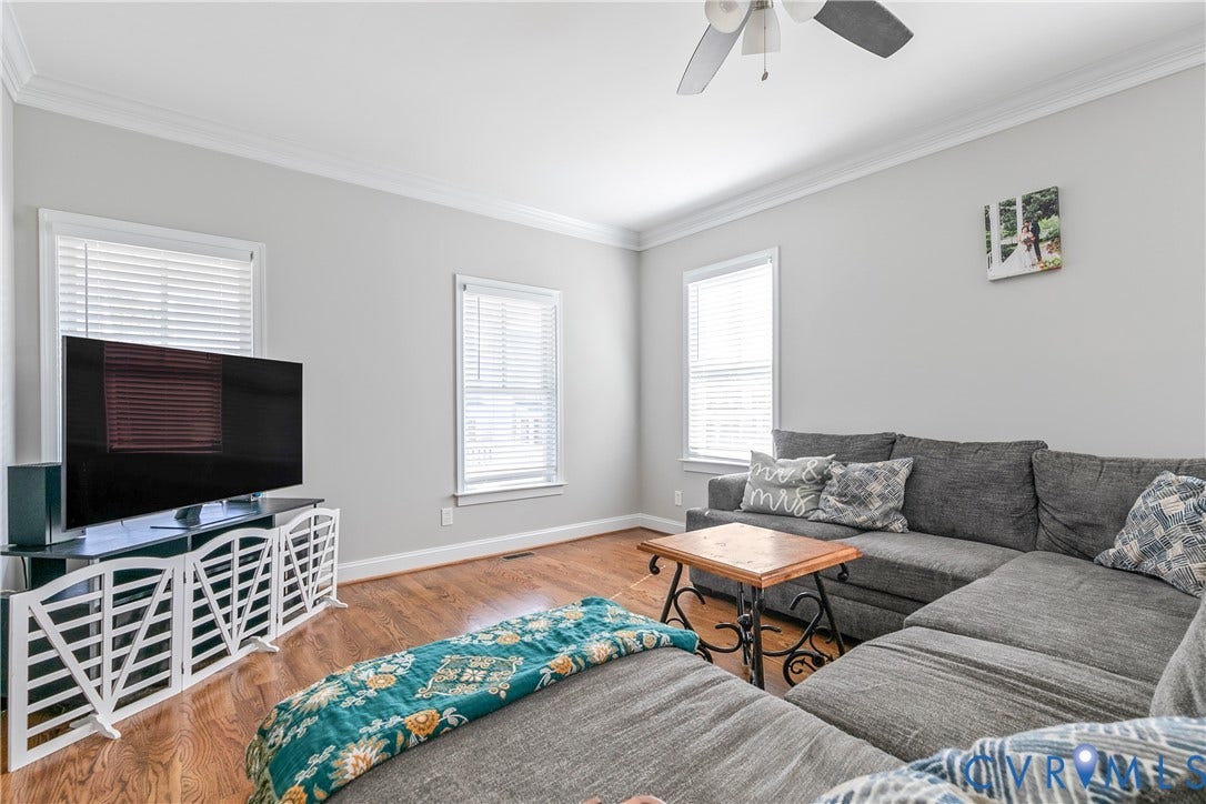 1301 Dance Street, Randolph, Richmond, VA 23220 Living area featuring wood-finish flooring, light gray wall paint, and white crown molding