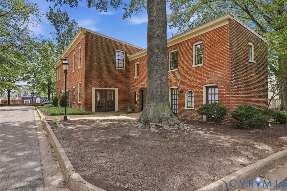 1443 Floyd Avenue, #208, The Fan, Richmond, VA 23220 Separate brick building with Community Room, pool entry, and maintenance manager's office.