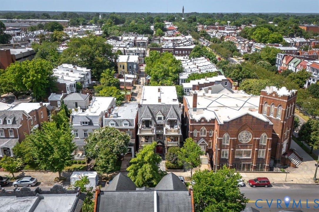 View of the odd numbered side of the 2700 block of Grove Ave. To the left of the Carlton Condos are several renovated single family home.