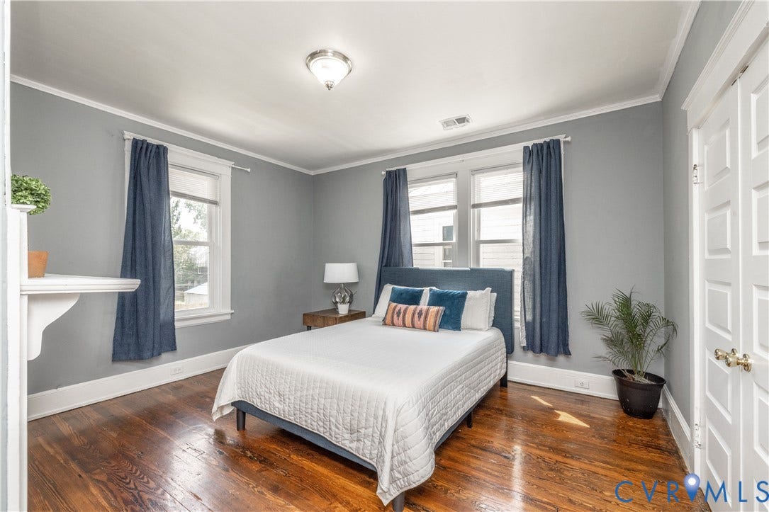 Hardwood flooring and gray painted walls