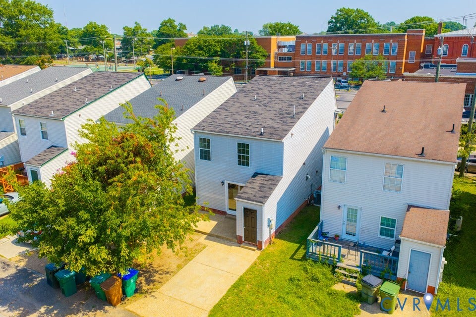 1409 Idlewood Avenue, Randolph, Richmond, VA 23220 Two-story residential structure with light-colored siding and a dark shingle roof