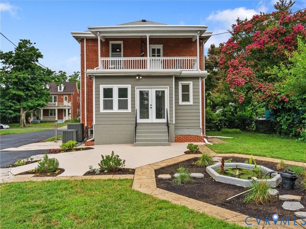 2911 Northumberland Avenue, Northside, Richmond, VA 23220 Rear exterior featuring a second-story balcony with white railings, a ground-level patio, and French doors