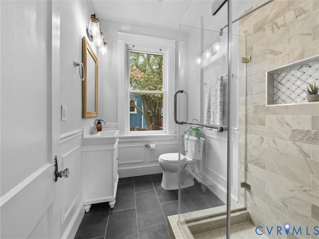 2911 Northumberland Avenue, Northside, Richmond, VA 23220 Bathroom featuring a glass-enclosed shower with horizontal tilework and a recessed niche