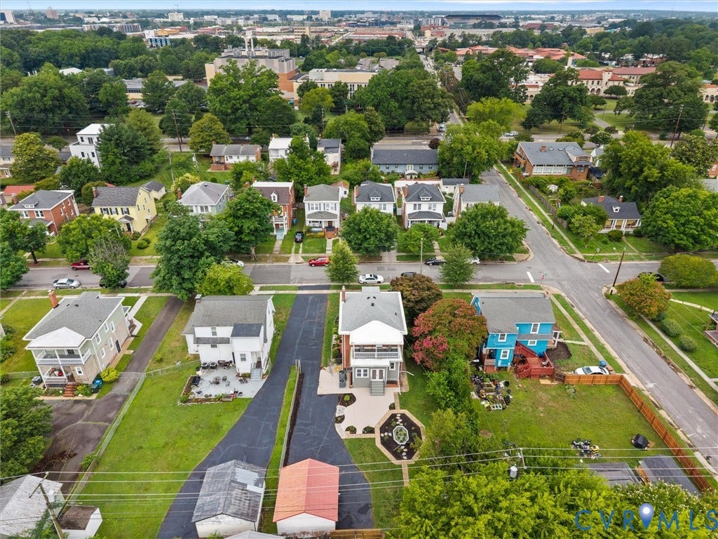 2911 Northumberland Avenue, Northside, Richmond, VA 23220 Aerial perspective showcasing a residential neighborhood with varied housing styles, mature trees, and surrounding urban elements