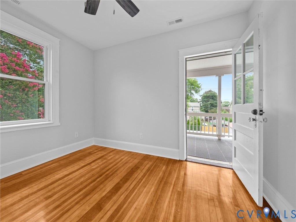 2911 Northumberland Avenue, Northside, Richmond, VA 23220 Room featuring wood-finish flooring, light gray walls, white trim, and a white framed window
