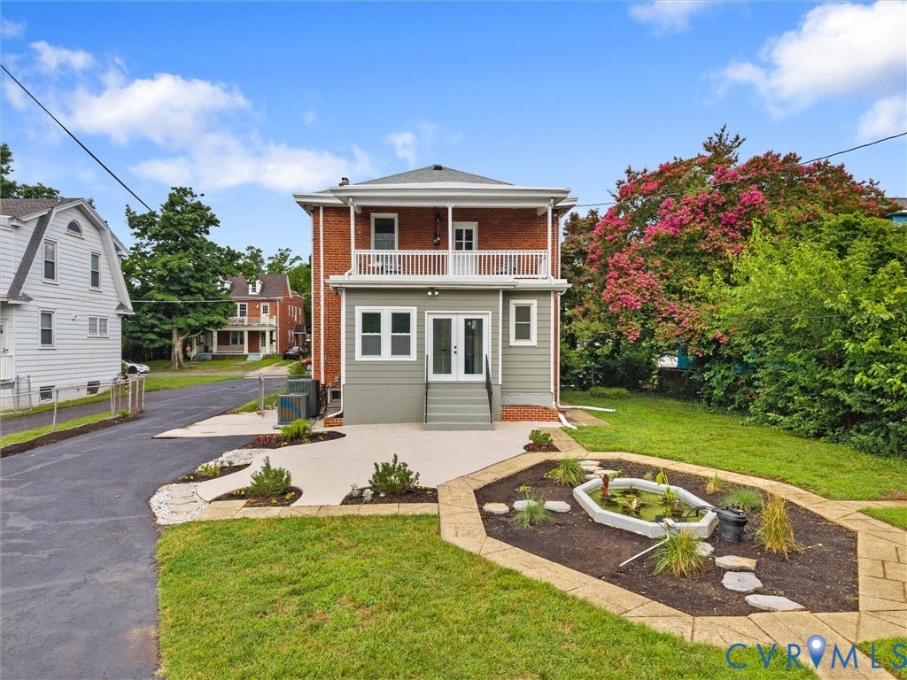2911 Northumberland Avenue, Northside, Richmond, VA 23220 Brick and siding exterior featuring an upper-level balcony with white railings