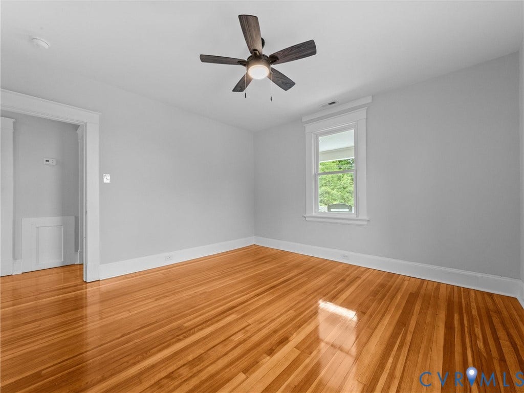 2911 Northumberland Avenue, Northside, Richmond, VA 23220 Hardwood flooring extending throughout, ceiling fan with integrated lighting, white trim and baseboards, and a window with exterior views
