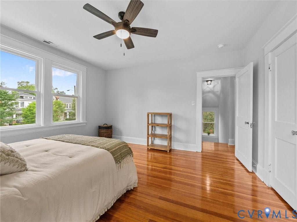 2911 Northumberland Avenue, Northside, Richmond, VA 23220 Bright interior space featuring wood-finish flooring, white walls, and a ceiling fan with integrated lighting