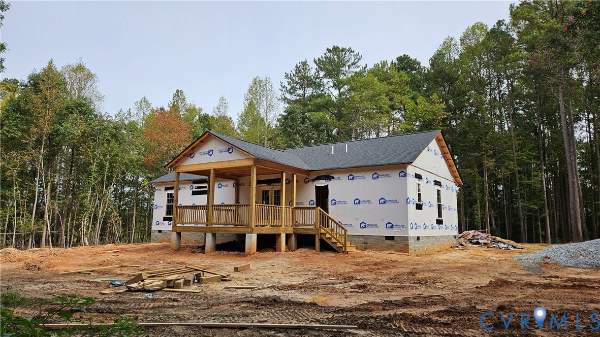 7920 S AMELIA AVENUE Avenue, Amelia Avenue, Amelia, VA 23002 New construction home featuring a covered front porch, dark shingle roof, and a wooded background
