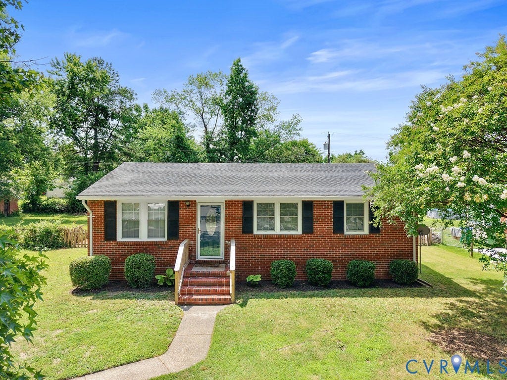 5527 Hansdale Road, Piney Knolls, Richmond, VA 23224 Brick ranch-style residence featuring a gray shingle roof and black louvered shutters