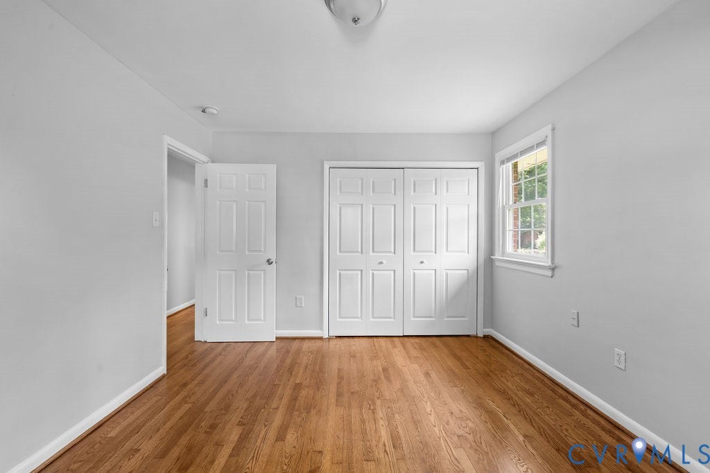 5527 Hansdale Road, Piney Knolls, Richmond, VA 23224 Room featuring wood-finish flooring, light grey walls, and white trim