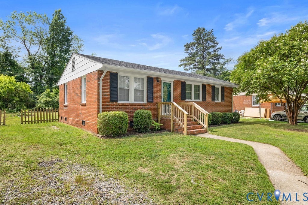 5527 Hansdale Road, Piney Knolls, Richmond, VA 23224 Brick exterior residence featuring a wooden front porch, manicured shrubbery, and a paved walkway