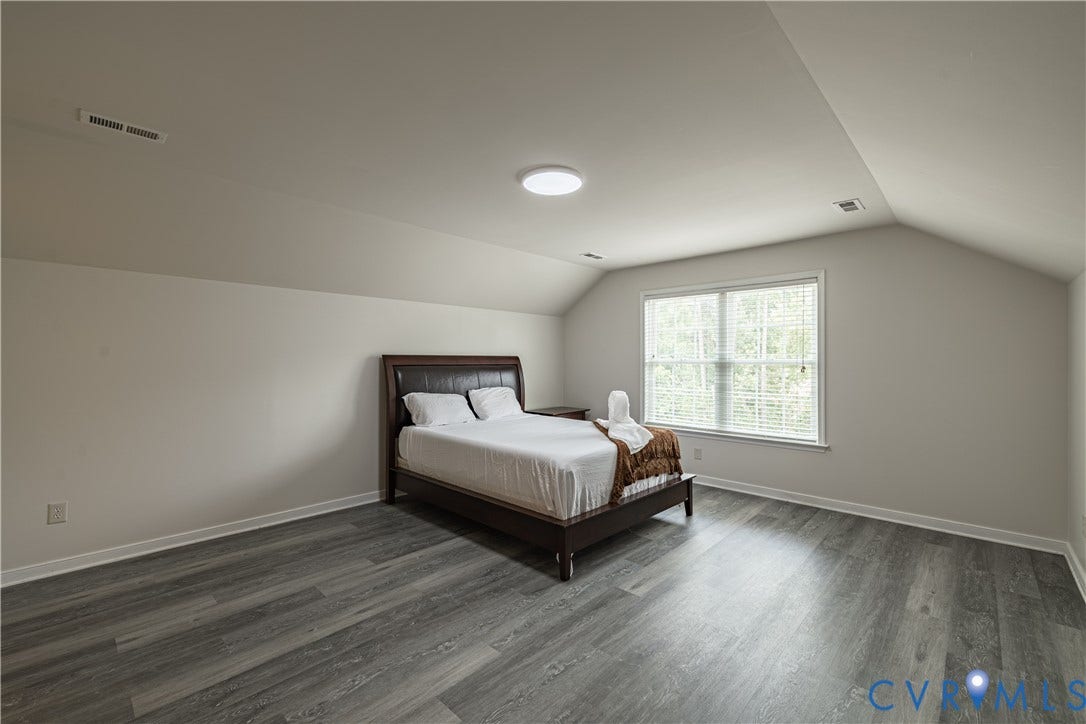 16814 Jennway Place, Moseley, VA 23120 Room featuring wood-finish flooring, a vaulted ceiling, recessed lighting, and a window with blinds
