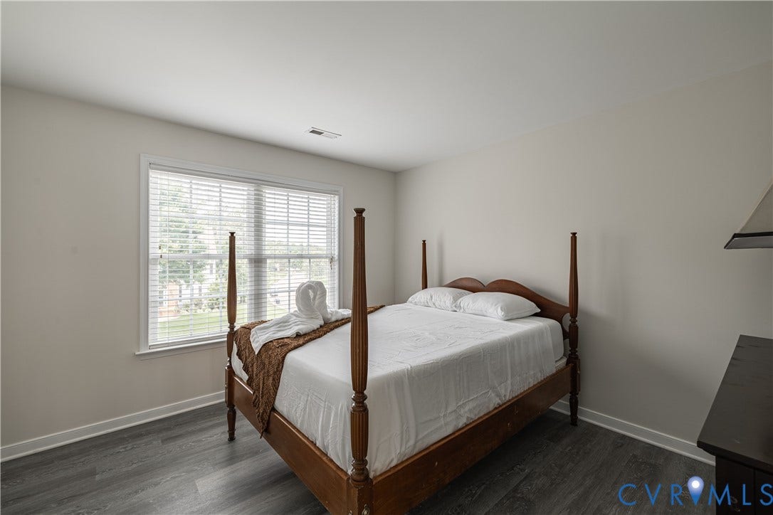 16814 Jennway Place, Moseley, VA 23120 Spacious room featuring wood-finish flooring and neutral wall tones