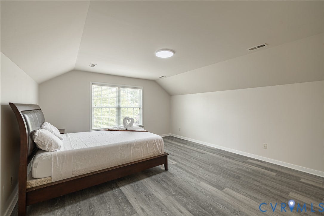 16814 Jennway Place, Moseley, VA 23120 Bright room featuring hardwood flooring, white walls, two double-hung windows with blinds, and white crown molding