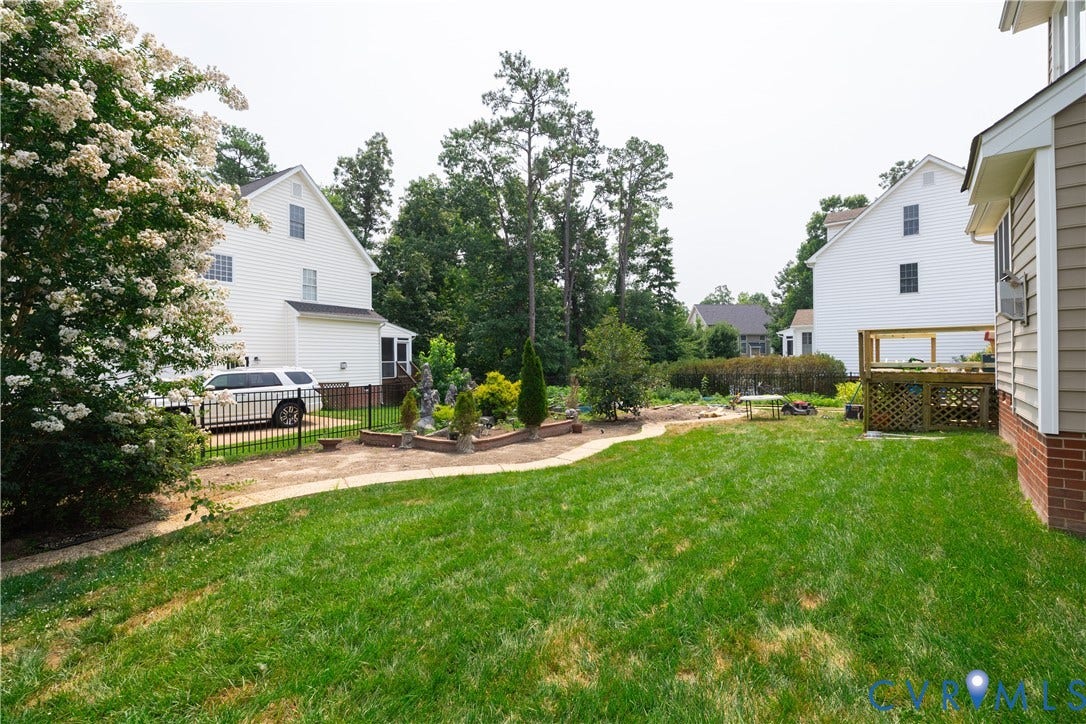 16814 Jennway Place, Moseley, VA 23120 Expansive green lawn with a curved paved pathway