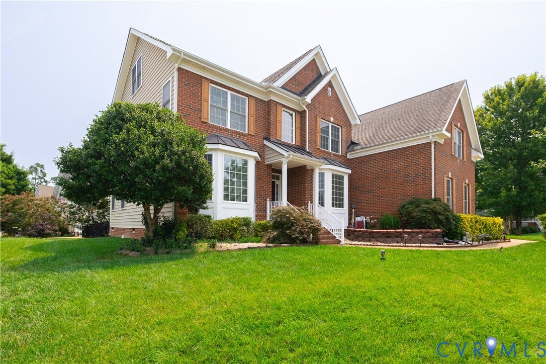16814 Jennway Place, Moseley, VA 23120 Brick and siding exterior featuring gabled rooflines