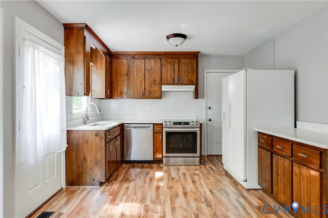 4419 Boones Bluff Way, Chesterfield, VA 23832 Kitchen featuring wood-finish flooring and solid wood cabinetry