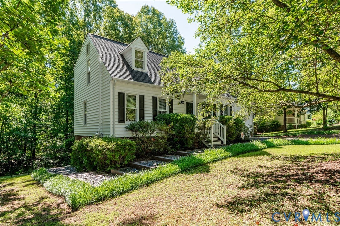 4419 Boones Bluff Way, Chesterfield, VA 23832 White siding exterior with black shutters and a covered front porch