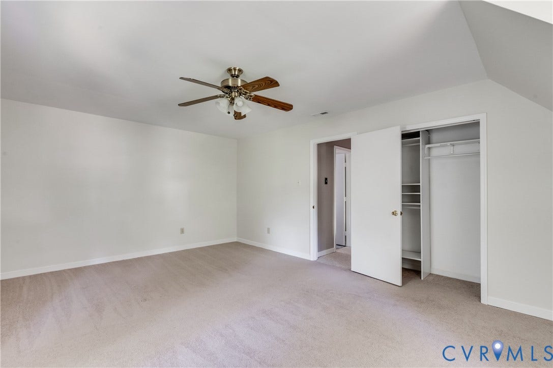 4419 Boones Bluff Way, Chesterfield, VA 23832 Spacious room with plush carpeting, neutral wall finishes, and a ceiling fan with integrated lighting
