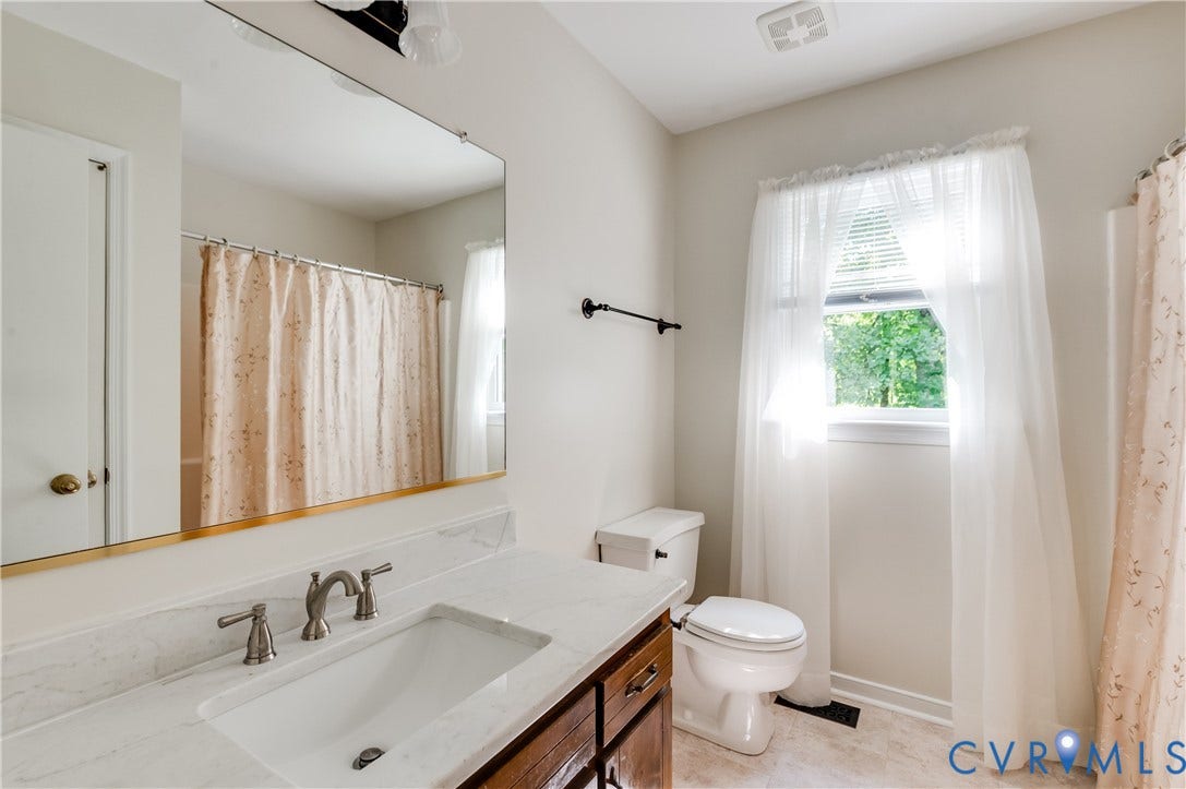 4419 Boones Bluff Way, Chesterfield, VA 23832 Bathroom vanity with a white countertop and integrated sink
