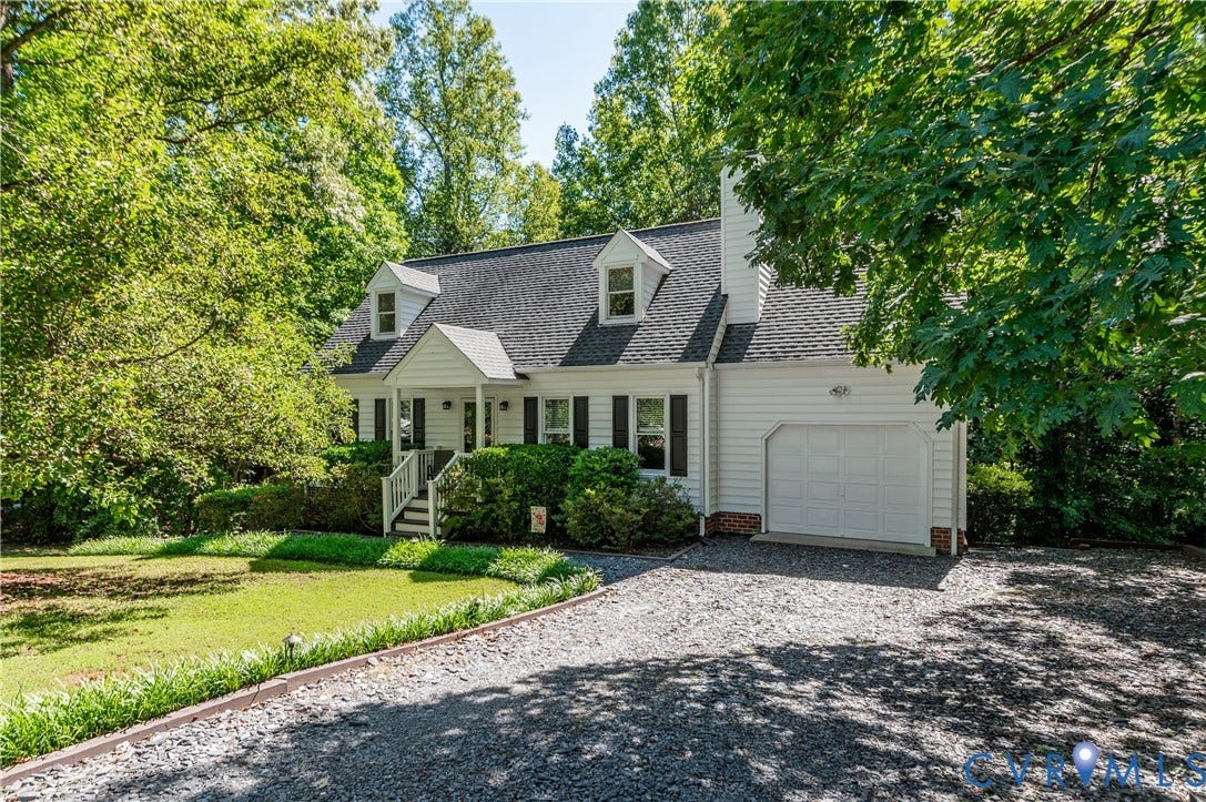 4419 Boones Bluff Way, Chesterfield, VA 23832 Traditional-style home featuring white siding, dark shutters, and a covered front porch