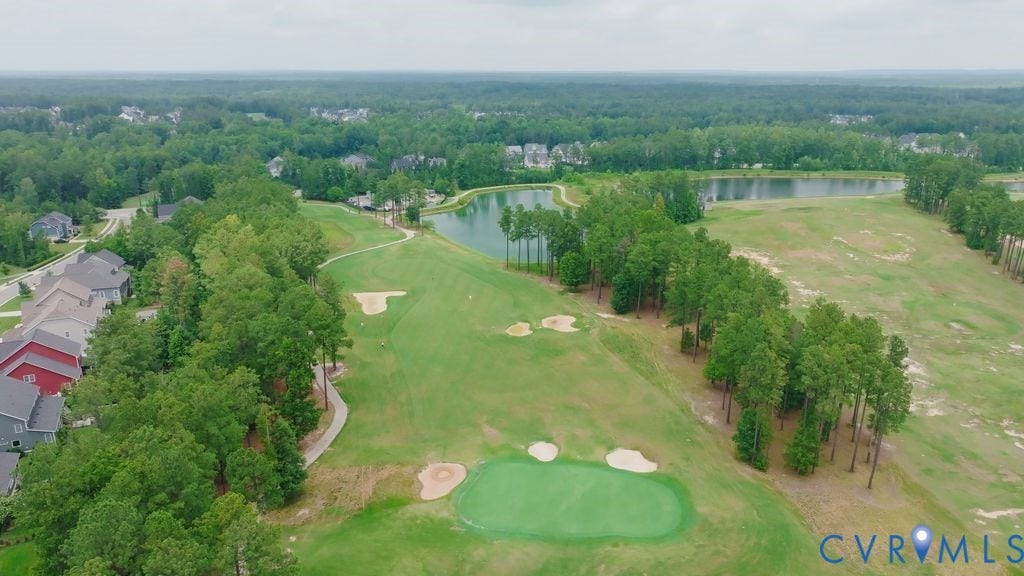 6991 Carden Park Drive, Carden Park, Moseley, VA 23120 Golf course frontage featuring a putting green, sand traps, and a waterway