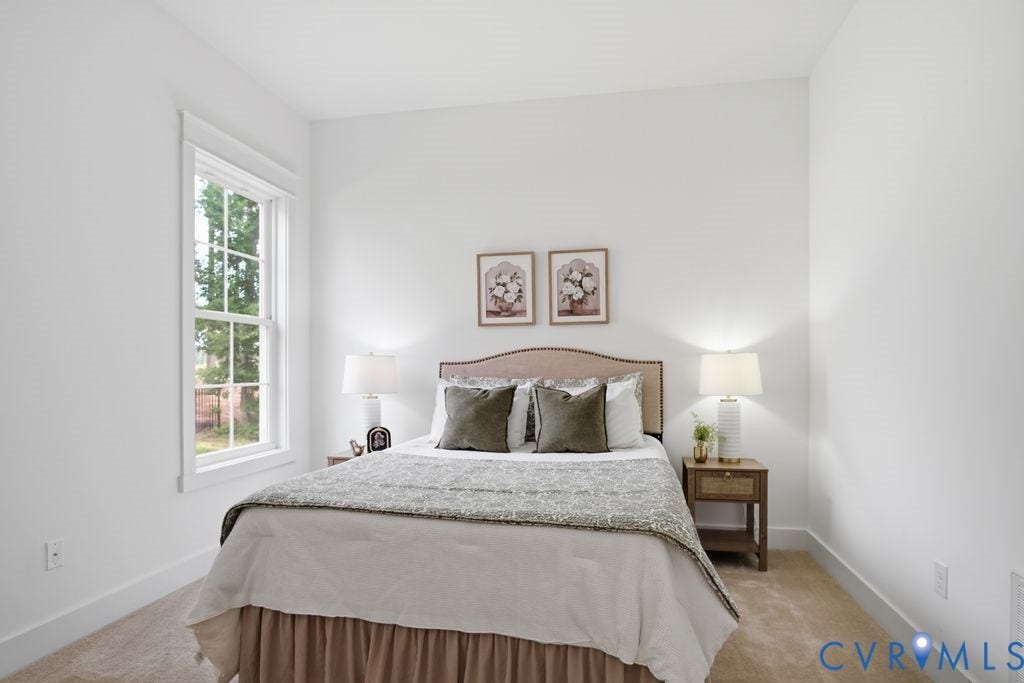 6991 Carden Park Drive, Carden Park, Moseley, VA 23120 Carpeted room featuring a double-hung window with a tree-lined exterior, light-colored walls, and white trim